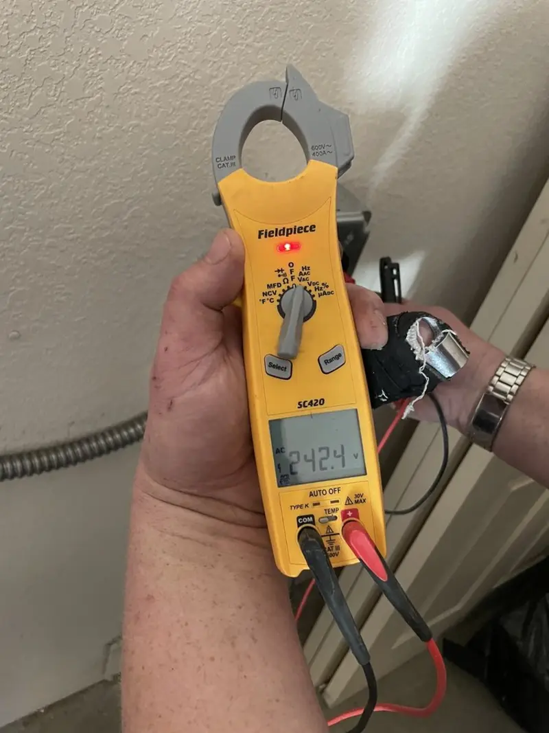 Voltage testing with clamp meter during Electrical Installation Services in Corinth